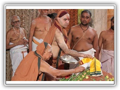Their Holiness performing Puja