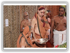 Their Holiness performing Puja