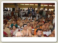 Devotees witnessing the Swarna Pada Puja