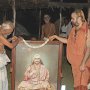 His Holiness garlanding a portrait of Sri Chandrasekharendra Saraswathi, 66th Acharya