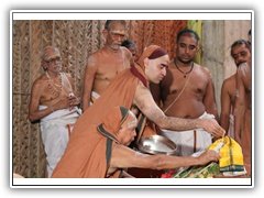 Their Holiness performing Puja