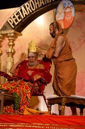 His Holiness being adorned with Crown and garland