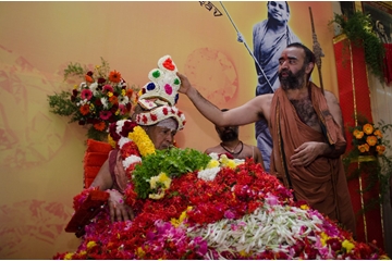 His Holiness being adorned with floral garland