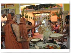 His Holiness performing pushpabhishekam